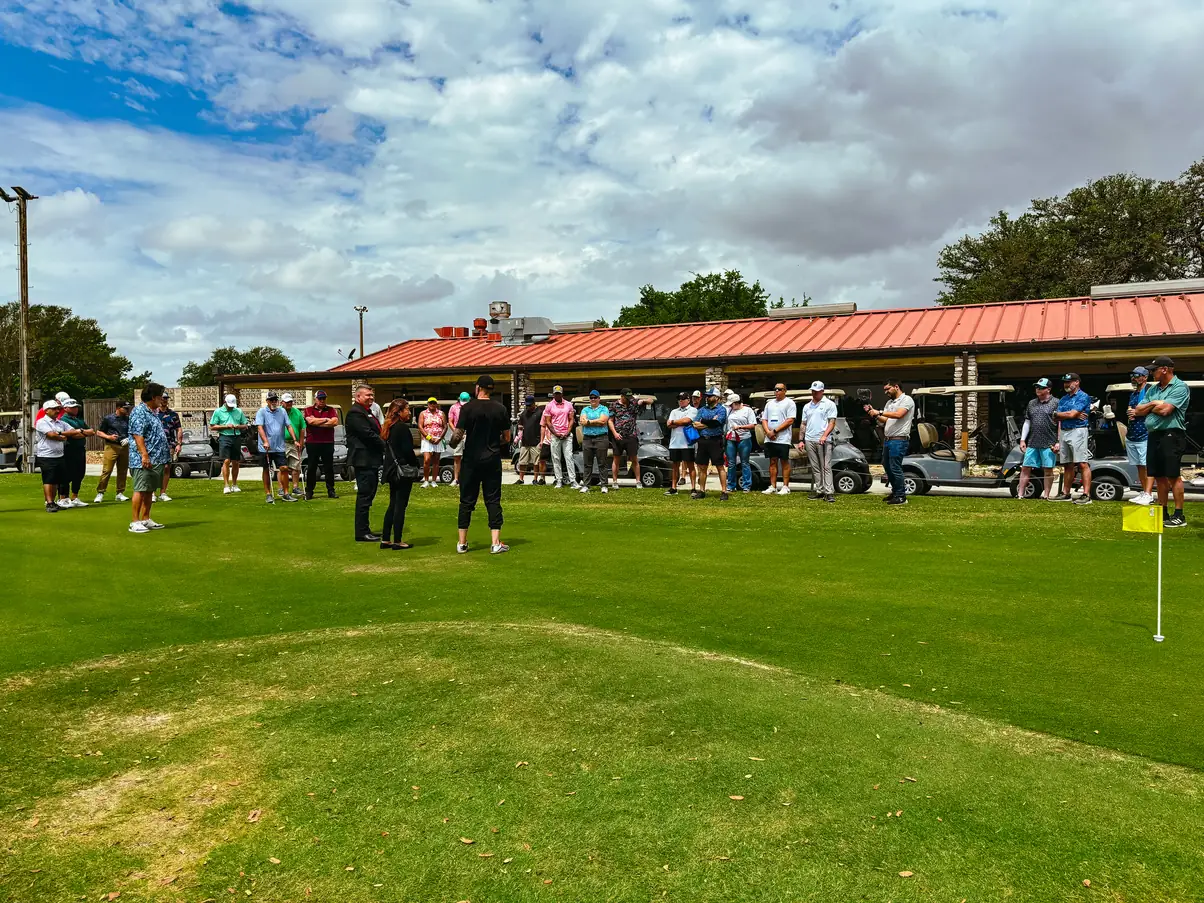 Golfers on the course at Swing Fore a Cause